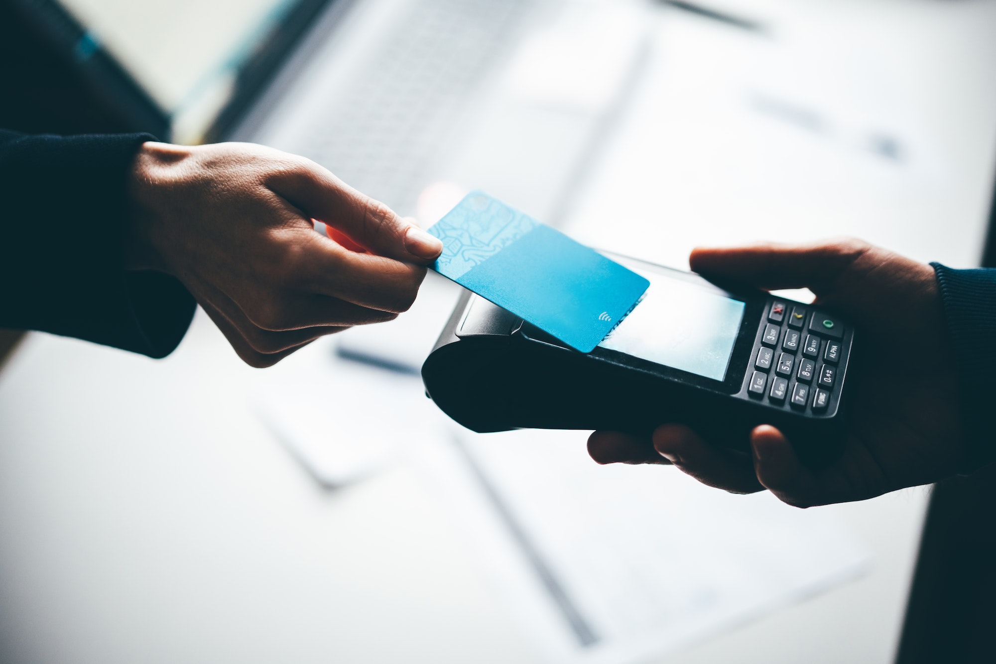 Customer Making Purchase Using Contactless Payment.